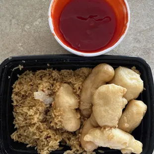 Half eaten but I have sweet-and-sour, chicken and fried rice I also had an eggroll.