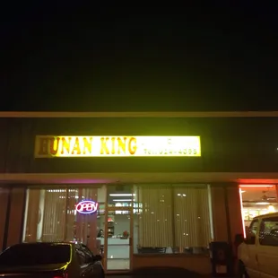 the front of a restaurant at night