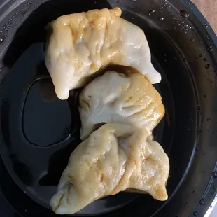 two dumplings in a frying pan