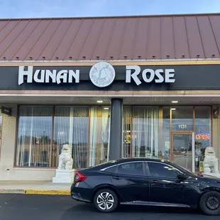 a car parked in front of the store