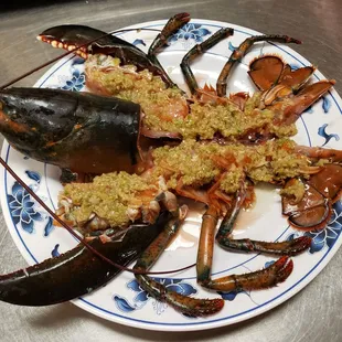 a plate of cooked lobsters
