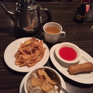Wonton Soup, and Egg Roll.  Small pot of hot tea to drink.