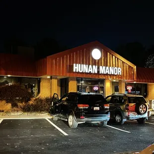 the front of the restaurant at night