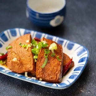 a blue and white plate of food