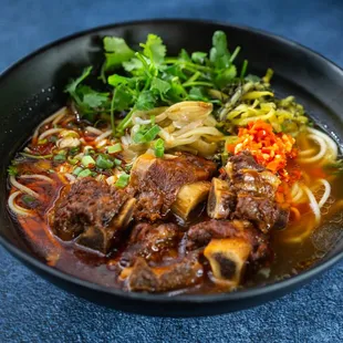 a bowl of beef and noodles