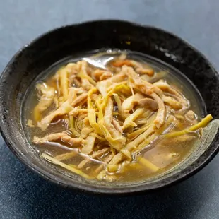 a bowl of chicken and noodles