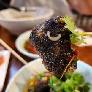 a piece of meat on a skewer