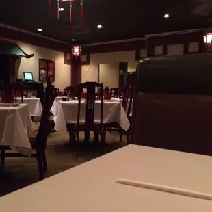 a dining room with tables and chairs