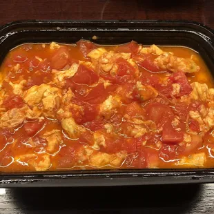 Sauteed egg with tomato. Their entrees don't come with rice, so you have to buy the rice separately