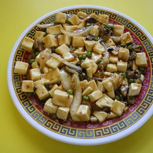 a bowl of tofu and peas