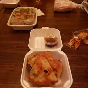 a meal in a styrofoam container