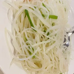 a plate of noodles and vegetables