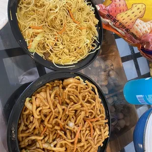 three bowls of noodles and a bag of chips