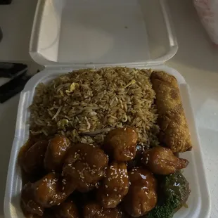 Sesame Chicken dinner combo fried rice and egg roll.