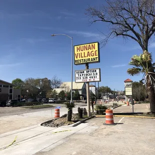 a sign on the corner of a street