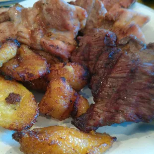 Sweet plantains and grilled pork, chicken and skirt steak