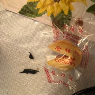 a sunflower and a cookie on a table