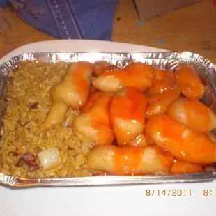 a plate of food with rice and carrots