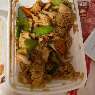 chicken and rice in a styrofoam container