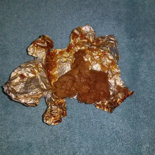 Paper wrapped chicken that is slimy, sour, smelly and rancid.