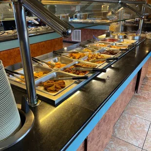 a buffet with a variety of food items