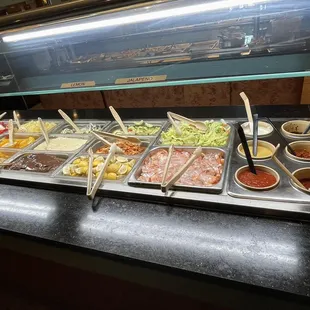 a buffet with a variety of food items