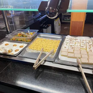 a variety of food items in a buffet