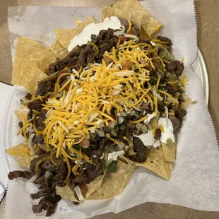 Super nachos with carne asada
