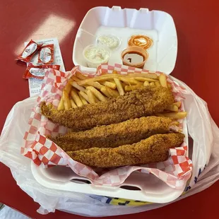 3 Catfish strips with fries.