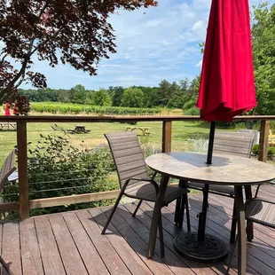 a table and chairs on a deck