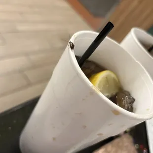 a drink in a paper cup