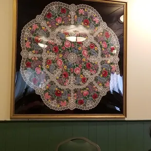 a woman sitting at a table in a restaurant