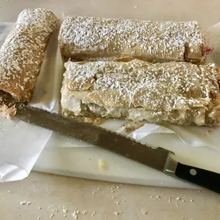 All three (serrated knife for scale). Two slices missing from each.