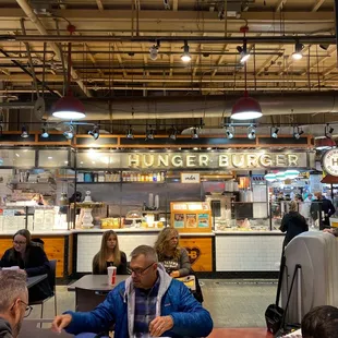 people sitting at a table eating