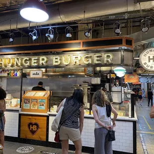 people standing in line at the counter