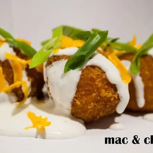 three fried meatballs with cheese and green onions