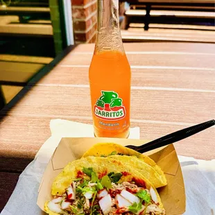 One braised beef, and one braised pork taco