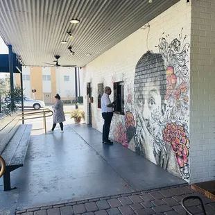 people walking down the sidewalk