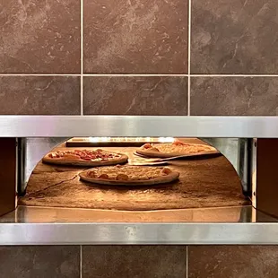 Pizza getting hot and the dough getting bubbly