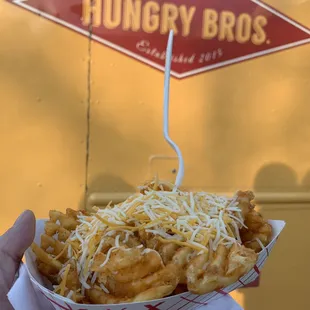 a person holding a basket of food