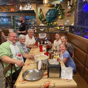 a group of people sitting at a table