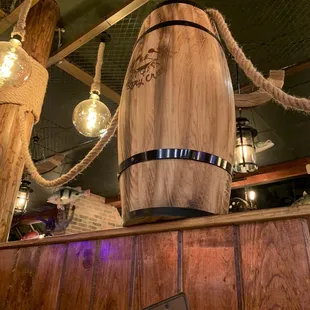 a large wooden barrel on a bar