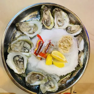 a plate of oysters on ice