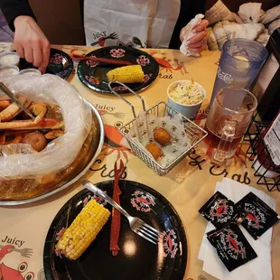 a woman sitting at a table with food