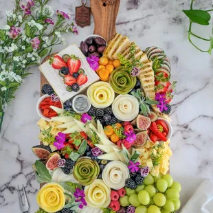 a platter of fruit and cheese