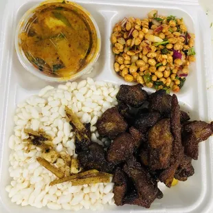 Mutton Sekuwa set (Marinated and grilled goat meat served with puffed rice, marinated soybean and Nepalese style pickle).