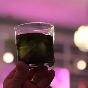 a person holding a glass of wine