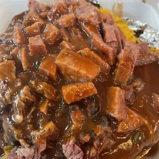 meat and gravy in a styrofoam container