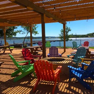 a picnic area with colorful chairs