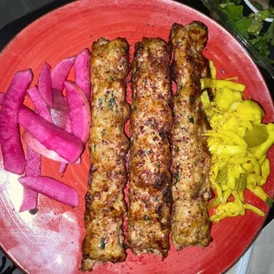 a plate of meat and vegetables